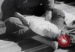 Image of mother wraps baby in swaddle Bethlehem Palestine, 1941, second 52 stock footage video 65675079605