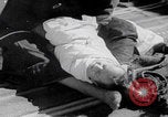 Image of mother wraps baby in swaddle Bethlehem Palestine, 1941, second 53 stock footage video 65675079605