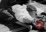 Image of mother wraps baby in swaddle Bethlehem Palestine, 1941, second 54 stock footage video 65675079605
