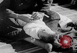 Image of mother wraps baby in swaddle Bethlehem Palestine, 1941, second 57 stock footage video 65675079605