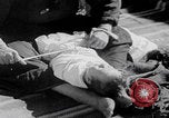 Image of mother wraps baby in swaddle Bethlehem Palestine, 1941, second 58 stock footage video 65675079605