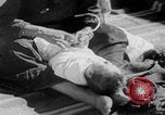 Image of mother wraps baby in swaddle Bethlehem Palestine, 1941, second 59 stock footage video 65675079605