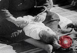 Image of mother wraps baby in swaddle Bethlehem Palestine, 1941, second 60 stock footage video 65675079605