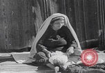 Image of mother wraps baby in swaddle Bethlehem Palestine, 1941, second 61 stock footage video 65675079605