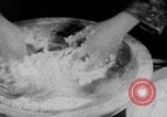Image of Palestinian boy and mother making bread Palestine, 1941, second 7 stock footage video 65675079606