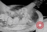 Image of Palestinian boy and mother making bread Palestine, 1941, second 8 stock footage video 65675079606