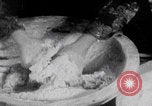 Image of Palestinian boy and mother making bread Palestine, 1941, second 10 stock footage video 65675079606