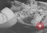 Image of Palestinian boy and mother making bread Palestine, 1941, second 14 stock footage video 65675079606