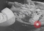 Image of Palestinian boy and mother making bread Palestine, 1941, second 15 stock footage video 65675079606