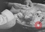 Image of Palestinian boy and mother making bread Palestine, 1941, second 16 stock footage video 65675079606