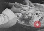 Image of Palestinian boy and mother making bread Palestine, 1941, second 17 stock footage video 65675079606