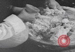 Image of Palestinian boy and mother making bread Palestine, 1941, second 19 stock footage video 65675079606