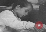 Image of Palestinian boy and mother making bread Palestine, 1941, second 21 stock footage video 65675079606