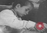 Image of Palestinian boy and mother making bread Palestine, 1941, second 22 stock footage video 65675079606