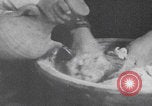 Image of Palestinian boy and mother making bread Palestine, 1941, second 25 stock footage video 65675079606