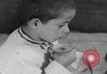 Image of Palestinian boy and mother making bread Palestine, 1941, second 39 stock footage video 65675079606