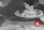 Image of Palestinian boy and mother making bread Palestine, 1941, second 41 stock footage video 65675079606