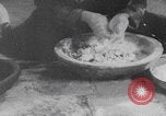 Image of Palestinian boy and mother making bread Palestine, 1941, second 42 stock footage video 65675079606