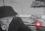 Image of Hungarian refugee shopping Chicago Illinois USA, 1956, second 9 stock footage video 65675079693