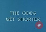 Image of casino dealer talks odds United States USA, 1967, second 16 stock footage video 65675079694
