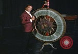 Image of casino dealer talks odds United States USA, 1967, second 29 stock footage video 65675079694