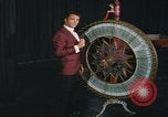 Image of casino dealer talks odds United States USA, 1967, second 30 stock footage video 65675079694