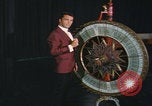 Image of casino dealer talks odds United States USA, 1967, second 31 stock footage video 65675079694