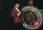 Image of casino dealer talks odds United States USA, 1967, second 33 stock footage video 65675079694