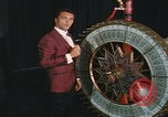 Image of casino dealer talks odds United States USA, 1967, second 34 stock footage video 65675079694