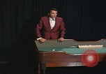 Image of casino dealer talks odds United States USA, 1967, second 50 stock footage video 65675079694
