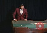 Image of casino dealer talks odds United States USA, 1967, second 53 stock footage video 65675079694
