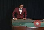 Image of casino dealer talks odds United States USA, 1967, second 54 stock footage video 65675079694