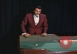 Image of casino dealer talks odds United States USA, 1967, second 55 stock footage video 65675079694