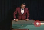 Image of casino dealer talks odds United States USA, 1967, second 56 stock footage video 65675079694