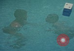Image of men splashing swimming pool Las Vegas Nevada USA, 1967, second 1 stock footage video 65675079700