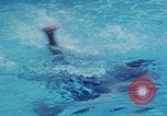 Image of men splashing swimming pool Las Vegas Nevada USA, 1967, second 3 stock footage video 65675079700