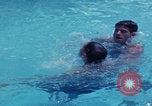 Image of men splashing swimming pool Las Vegas Nevada USA, 1967, second 5 stock footage video 65675079700