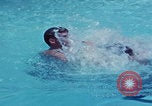 Image of men splashing swimming pool Las Vegas Nevada USA, 1967, second 6 stock footage video 65675079700