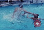 Image of men splashing swimming pool Las Vegas Nevada USA, 1967, second 10 stock footage video 65675079700