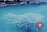 Image of men splashing swimming pool Las Vegas Nevada USA, 1967, second 11 stock footage video 65675079700