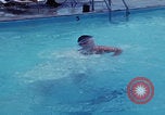 Image of men splashing swimming pool Las Vegas Nevada USA, 1967, second 12 stock footage video 65675079700