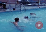 Image of men splashing swimming pool Las Vegas Nevada USA, 1967, second 16 stock footage video 65675079700