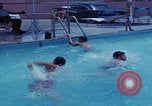 Image of men splashing swimming pool Las Vegas Nevada USA, 1967, second 18 stock footage video 65675079700