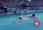 Image of men splashing swimming pool Las Vegas Nevada USA, 1967, second 19 stock footage video 65675079700