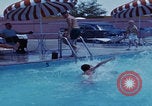 Image of men splashing swimming pool Las Vegas Nevada USA, 1967, second 20 stock footage video 65675079700