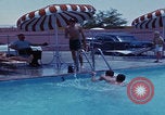 Image of men splashing swimming pool Las Vegas Nevada USA, 1967, second 21 stock footage video 65675079700