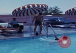 Image of men splashing swimming pool Las Vegas Nevada USA, 1967, second 22 stock footage video 65675079700