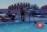 Image of men splashing swimming pool Las Vegas Nevada USA, 1967, second 24 stock footage video 65675079700