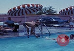Image of men splashing swimming pool Las Vegas Nevada USA, 1967, second 25 stock footage video 65675079700