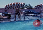 Image of men splashing swimming pool Las Vegas Nevada USA, 1967, second 26 stock footage video 65675079700